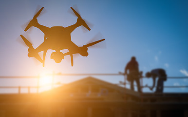 Image showing Silhouette of Unmanned Aircraft System (UAV) Quadcopter Drone In