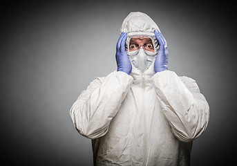 Image showing Man Holding Head With Hands Wearing HAZMAT Protective Clothing A