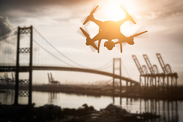 Image showing Silhouette of Unmanned Aircraft System (UAV) Quadcopter Drone In