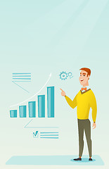 Image showing Successful businessman pointing at chart going up.