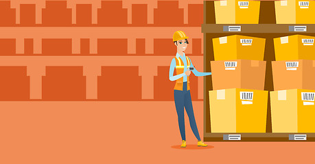 Image showing Warehouse worker scanning barcode on box.