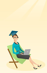 Image showing Graduate lying in chaise lounge with laptop.