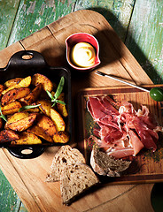 Image showing Potato Wedges and Jamon