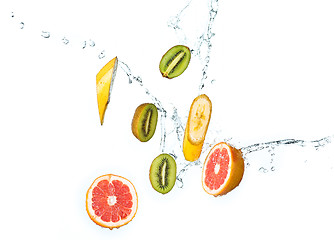 Image showing Fresh fruits falling in water splash, isolated on white background