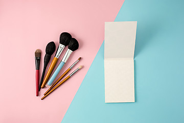 Image showing Make up brushes on colorful background