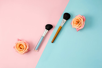 Image showing Make up brushes on colorful background