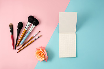 Image showing Make up brushes on colorful background