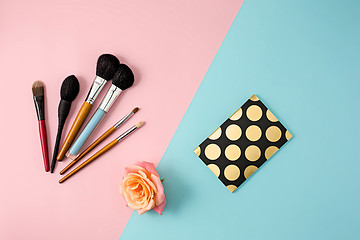 Image showing Make up brushes on colorful background