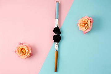 Image showing Make up brushes on colorful background