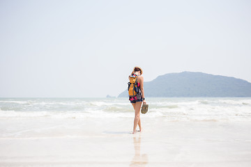 Image showing Woman in hat on seashore