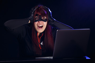 Image showing Brunette steals information from computer