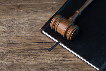 Image showing Judge\'s hammer on black folder