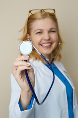 Image showing Beautiful woman in medical dressingbackground