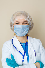 Image showing Doctor in mask, gloves, coat