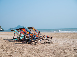 Image showing Sandy beach with chaise lounges