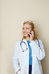 Image showing Handsome doctor talking on phone
