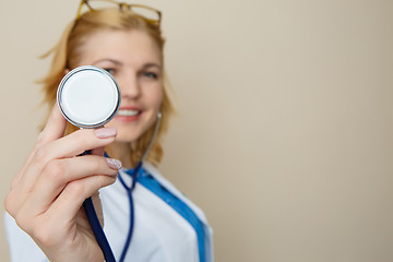 Image showing Blonde in glasses with phonendoscope