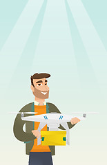 Image showing Man controlling delivery drone with post package