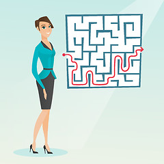 Image showing Business woman looking at labyrinth with solution