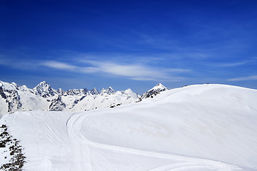 Image showing Off-piste slope for freeriding with track from snow grooming in 