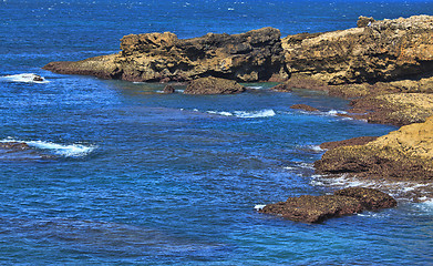 Image showing Rocky Coast Extending into the Sea