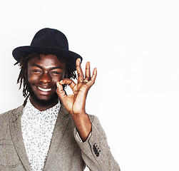 Image showing young handsome afro american boy in stylish hipster hat gesturing emotional isolated on white background smiling, lifestyle people concept 