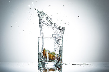 Image showing water splash in glass of gray color