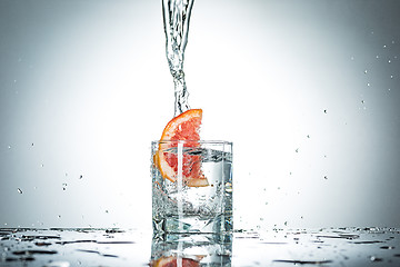 Image showing water splash in glass of gray color