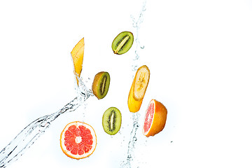 Image showing Fresh fruits falling in water splash, isolated on white background