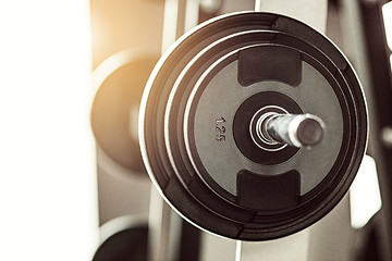 Image showing Close up view of barbell on floor in gym