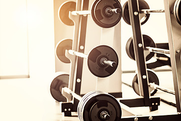 Image showing Close up view of barbell on floor in gym