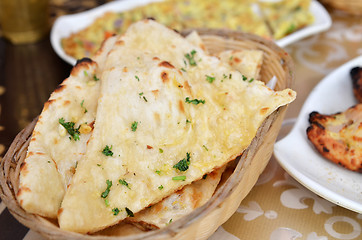 Image showing Garlic and coriander naan on a basket