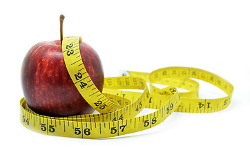 Image showing Red apple with measure tape