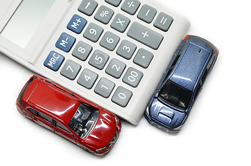 Image showing Blue and red car with calculator