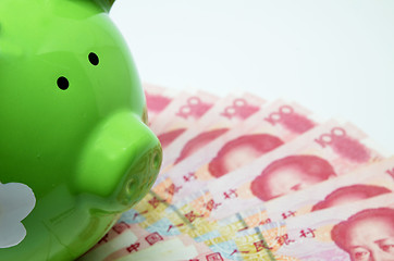 Image showing Green piggy bank with China currency