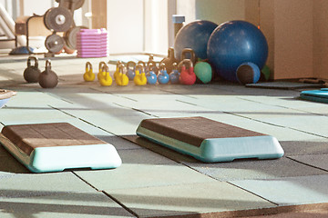 Image showing interior of rehabilitation gym, with equiment: balls, mats, steps