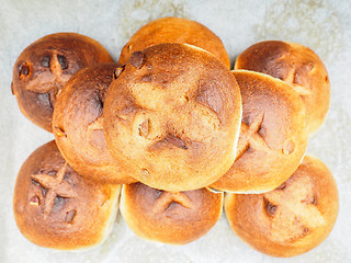 Image showing Pumkin seed buns on baking paper sfter baking at close-up in a n