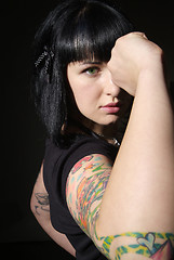 Image showing woman with tattoo and fist