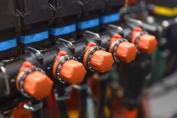 Image showing Many red valves closeup