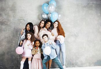 Image showing Lifestyle and people concept: young pretty diversity nations woman with different age children celebrating on birth day party together happy smiling, making selfie. African-american, asian and caucasi