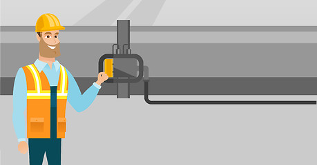 Image showing Operator checking detector on gas pipeline.