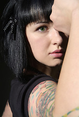 Image showing woman with tattoo and fist