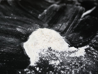 Image showing powder(flour) on black