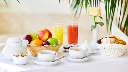 Image showing delicious breakfast for two at the luxury hotel.