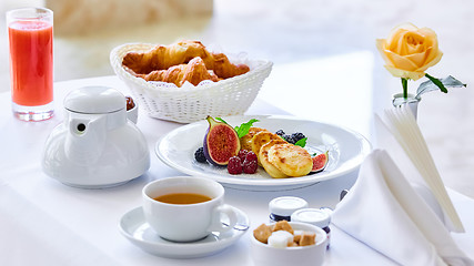 Image showing delicious breakfast for two at the luxury hotel.