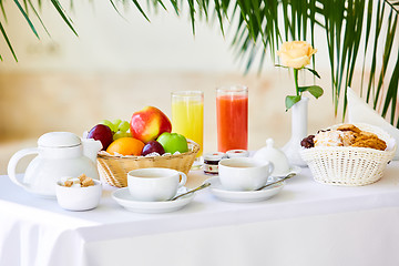 Image showing delicious breakfast for two at the luxury hotel.