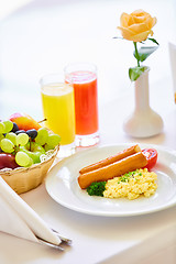 Image showing delicious breakfast for two at the luxury hotel.