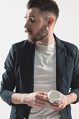 Image showing Portrait of stylish handsome young man with cup of coffee
