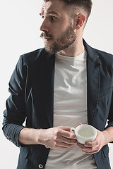 Image showing Portrait of stylish handsome young man with cup of coffee