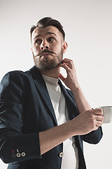 Image showing Portrait of stylish handsome young man with cup of coffee